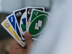 person-holding-uno-cards-2689343
